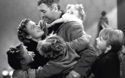 Little Zuzu Bailey hangs onto her father’s back at the climax of the film. Clockwise from top: James Stewart, Donna Reed, Carol Coombs, Jimmy Hawkins, Larry Simms and Karolyn Grimes. Photo by Herbert Dorfman/Corbis via Getty Images